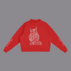 A red cropped crewneck sweatshirt featuring a white line art graphic of an owl on the chest and white script text on both sleeves, displayed against a solid white background.