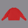 A red cropped sweatshirt shown from the back, featuring white cursive script graphics printed on both sleeves, displayed against a solid white background.